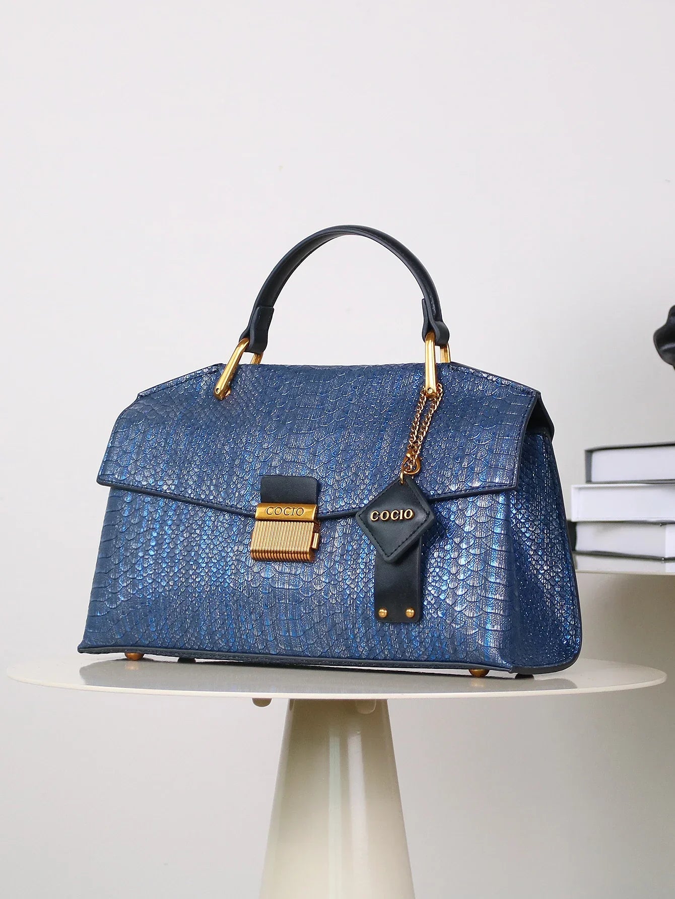 Women’s Top Handle Bag with Embossed Texture and Front Flap Closure
